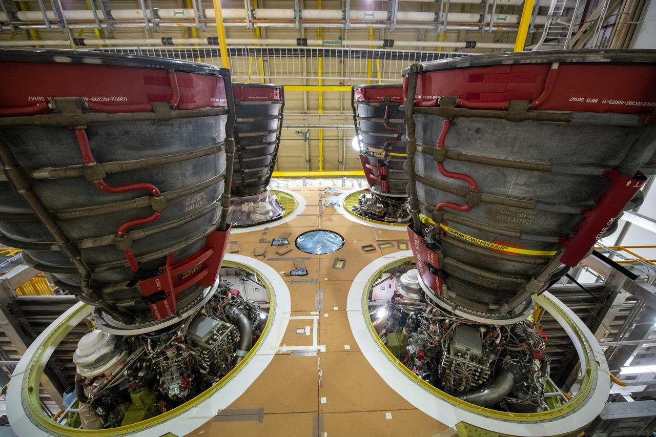 This photo shows all four RS-25 engines attached to the core stage for NASA’s Space Launch System rocket for the agency’s Artemis I mission to the Moon. To complete assembly of the rocket stage, engineers and technicians at NASA’s Michoud Assembly Facility in New Orleans are now integrating the propulsion and electrical systems within the structure. The completed core stage with all four RS-25 engines attached is the largest rocket stage NASA has built since the Saturn V stages for the Apollo Program that first sent Americans to the Moon. The stage, which includes two propellant tanks, provides more than 2 million pounds of thrust to send Artemis I to the Moon. Engineers and technicians attached the fourth RS-25 engine to the rocket stage Nov. 6 just one day after structurally mating the third engine. The first two RS-25 engines were structurally mated to the stage in October. After assembly is complete, crews will conduct an integrated functional test of flight computers, avionics and electrical systems that run throughout the 212-foot-tall core stage in preparation for its completion later this year. This testing is the first time all the flight avionics systems will be tested together to ensure the systems communicate with each other and will perform properly to control the rocket’s flight. Integration of the RS-25 engines to the recently completed core stage structure is a collaborative, multistep process for NASA and its partners Boeing, the core stage lead contractor, and Aerojet Rocketdyne, the RS-25 engines lead contractor.  Offering more payload mass, volume capability and energy to speed missions through space, the SLS rocket, along with NASA’s Gateway in lunar orbit and Orion, is part of NASA’s backbone for deep space exploration and the Artemis lunar program. No other rocket is capable of carrying astronauts in Orion around the Moon in a single mission.